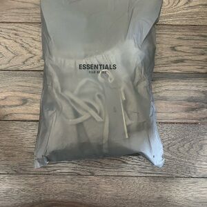 ESSENTIALS Fear of God Sweat Pants in Grey Packaging